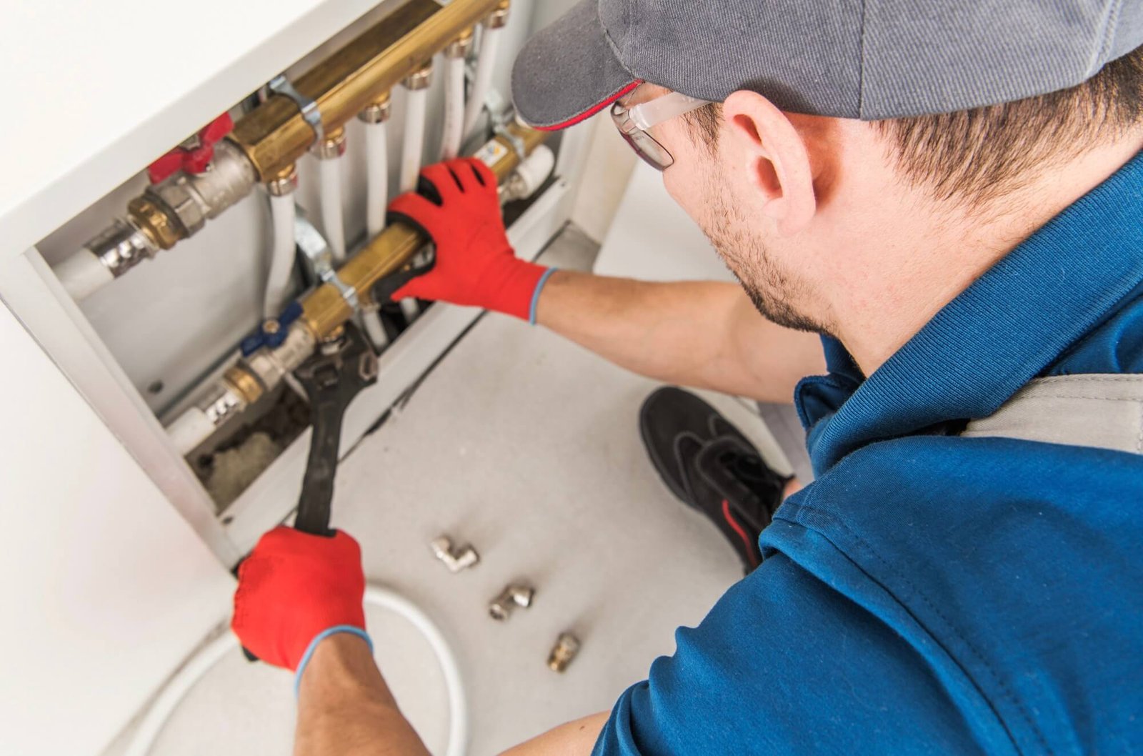 Drain cleaning technician fixing home drain system in Dallas TX