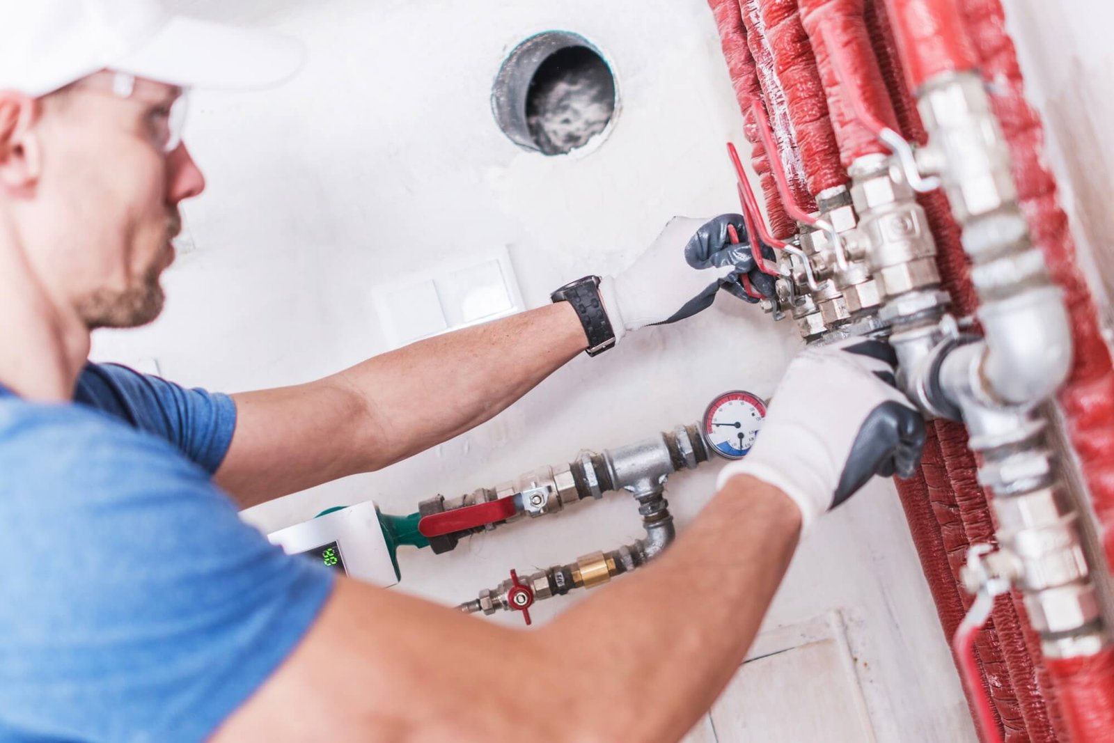 Professional drain cleaning technician working on home drain system in Dallas TX